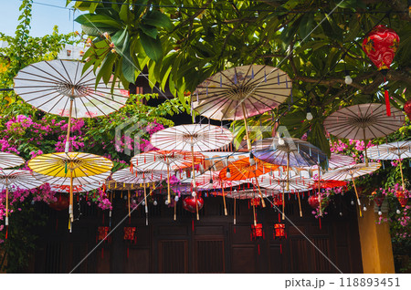 Colorful decorative Asian Japanese umbrellas decorate street in Hoi an in Asia Colorful decorative Asian Japanese umbrellas decorate street in Hoi an in Asia 118893451
