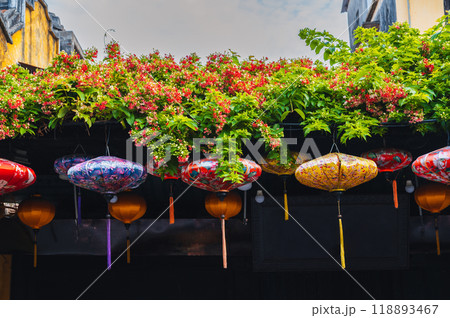 Colorful Chinese lanterns decorate the wall of a traditional Asian house for Chinese New Year holiday in Asia in Hoi an in day 118893467