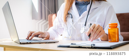 Doctor records health examination results and medication usage of patient, healthcare and medical checkup concept. Doctor records health examination results and medication usage of patient, healthcare and medical checkup concept. 118893875