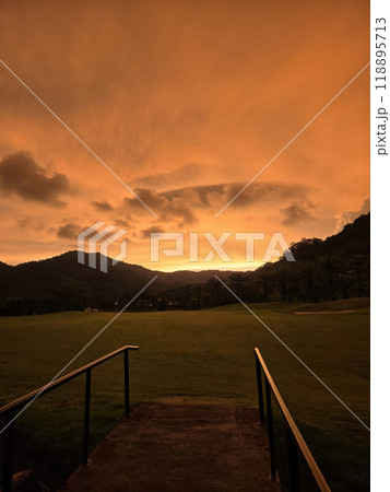 sunset in the tropics with a bridge and clouds 118895713