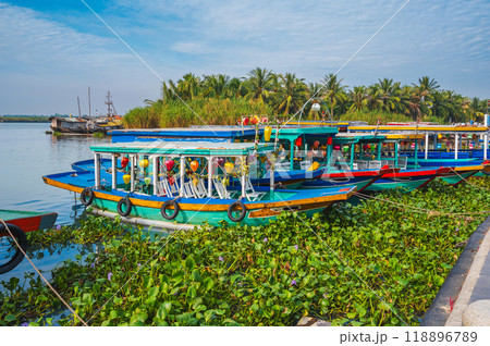 Vietnamese boats on the Thu bon river in old town in Hoi An in Vietnam in summer 118896789