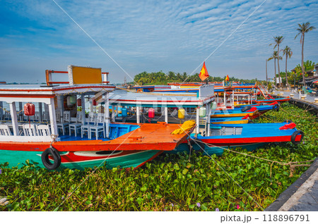 Traditional wooden Vietnamese boats on Thu bon river in the old town in Hoi An in Vietnam in summer 118896791