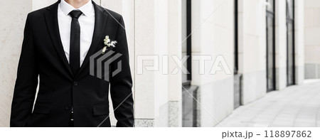 groom in black jacket and tie groom in black jacket and tie 118897862