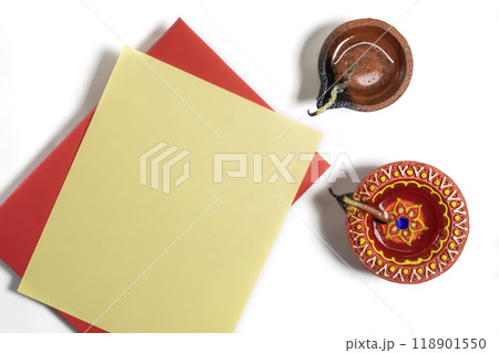 Happy Diwali celebration greeting card and clay diya lamp on white background. Happy Diwali celebration greeting card and clay diya lamp on white background. 118901550
