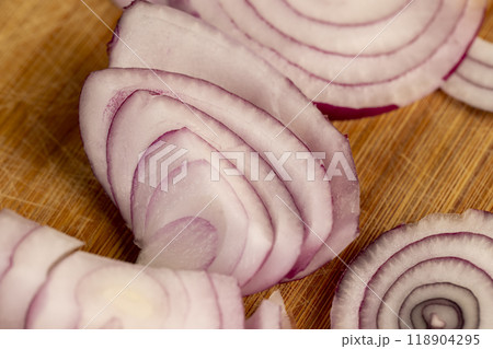 preparing red onions for cooking in dishes 118904295