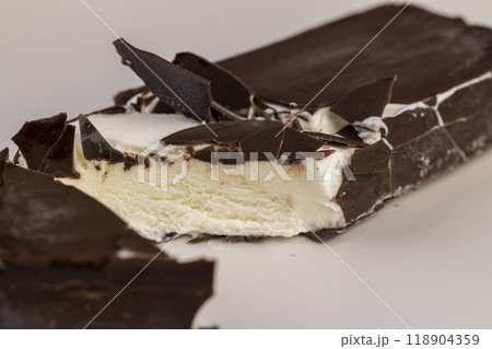 natural eco-friendly ice cream in chocolate glaze lies on a plate natural eco-friendly ice cream in chocolate glaze lies on a plate 118904359