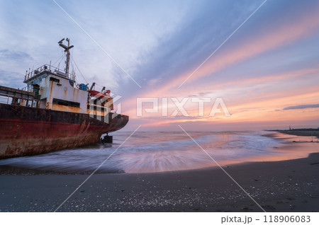 Silhouetted Shipwreck at Sunset, Xigushui Beach, Tainan. 118906083