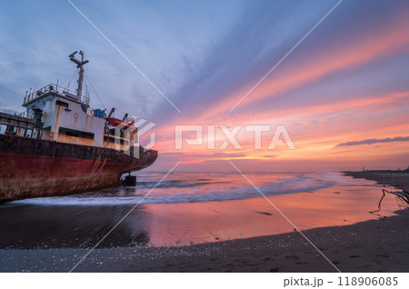 Silhouetted Shipwreck at Sunset, Xigushui Beach, Tainan. 118906085