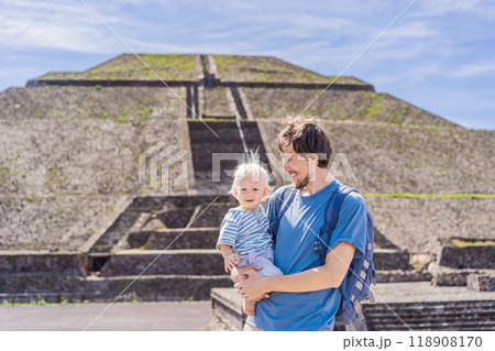 Father and son tourists exploring Teotihuacan, Mexico. Cultural heritage, ancient ruins, and archaeological adventure concept Father and son tourists exploring Teotihuacan, Mexico. Cultural heritage, ancient ruins, and archaeological adventure concept 118908170