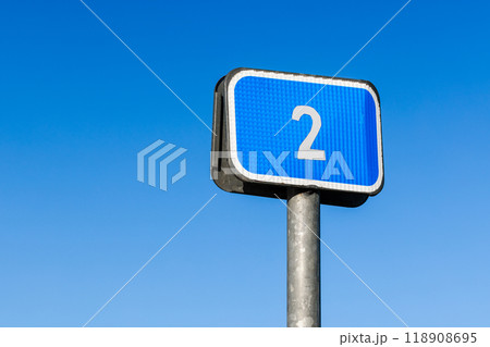 Blue road sign with 2 sign is under blue sky background, close up Blue road sign with 2 sign is under blue sky background, close up 118908695