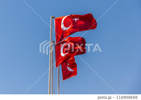 Flags of Turkey are under clear blue sky on a sunny day Flags of Turkey are under clear blue sky on a sunny day 118908698