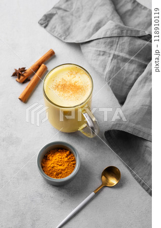 Turmeric golden milk latte with spices and honey. Detox, immunity boosting, anti-inflammatory  drink 118910119