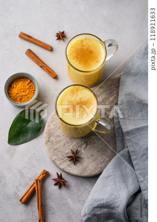 Turmeric golden milk latte with spices and honey. Detox, immunity boosting, anti-inflammatory drink Turmeric golden milk latte with spices and honey. Detox, immunity boosting, anti-inflammatory drink 118911633