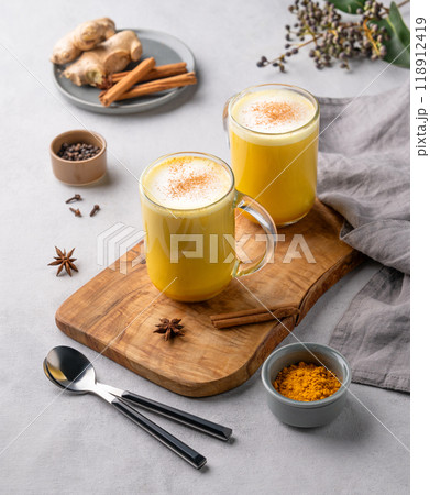 Turmeric golden milk latte with spices and honey. Detox, immunity boosting, anti-inflammatory 118912419