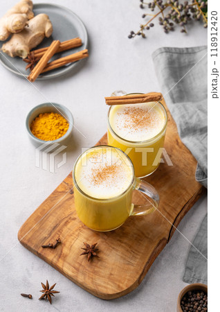 Turmeric golden milk latte with spices and honey. Detox, immunity boosting, anti-inflammatory drink 118912420