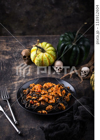 Halloween dish black pasta with bolognese 118912604