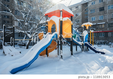 Snow playground in the courtyard of apartment buildings in winter 118913053