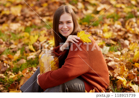 girl enjoying warm autumn in the park, hello autumn, autumn mood girl enjoying warm autumn in the park, hello autumn, autumn mood 118915739