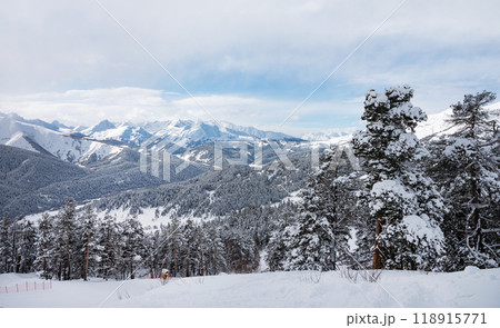 Beautiful landscape of the Arkhyz ski resort with mountains, snow and forest on a sunny winter day.  118915771