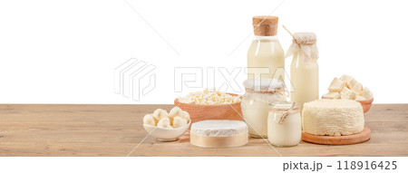 Different fresh dairy products on a wooden table isolated on white background. clipping path included 118916425