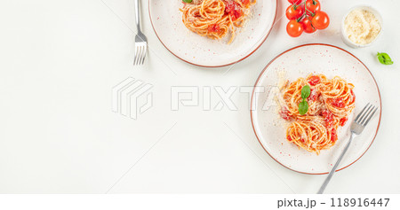 Delicious pasta with tomato sauce, basil and cheese on a light background, Long banner format. top view. copy space Delicious pasta with tomato sauce, basil and cheese on a light background, Long banner format. top view. copy space 118916447