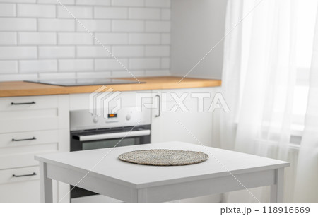 Wooden tabletop with napkin for product montage or mockup 118916669