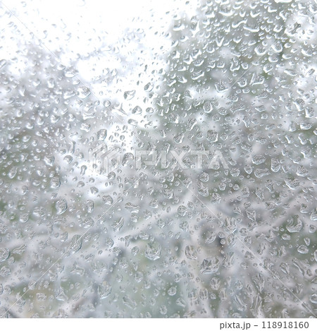frozen drops of rain or wet snow on the window glass 118918160