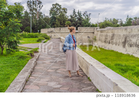 Female tourist exploring the Loreto Fort Museum in Puebla, Mexico. Cultural heritage, history, and travel exploration concept 118918636