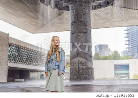 Female tourist exploring the National Museum of Anthropology in Mexico City. Cultural heritage and historical exploration concept Female tourist exploring the National Museum of Anthropology in Mexico City. Cultural heritage and historical exploration concept 118918652
