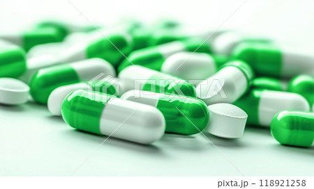 A pile of green and white pills 118921258