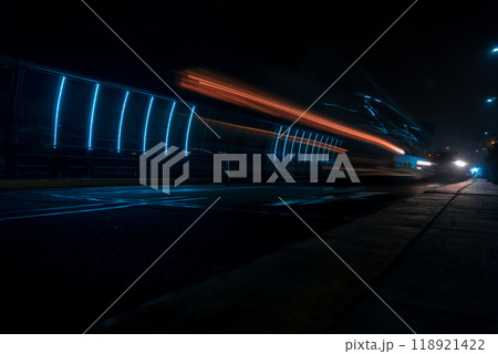 Blurry image of a train on a dark street at night. Miraflores, Lima Peru. 118921422