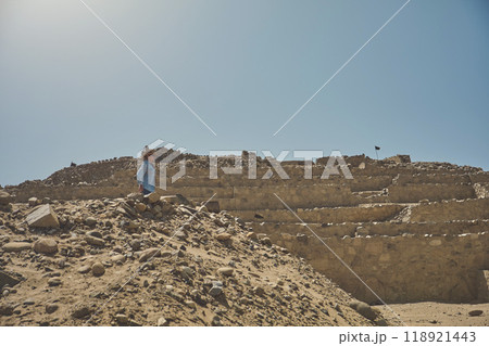 Young Latin woman in archaeological site of the Sacred City of Caral, Peru. 118921443