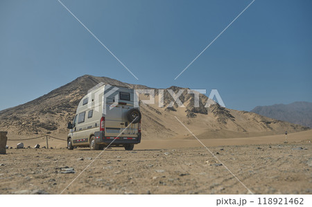 Camper in archaeological site of Caral, near Supe, Barranca Province, Peru. Caral is a UNESCO world heritage site and considered to be the oldest city in the Americas. 118921462