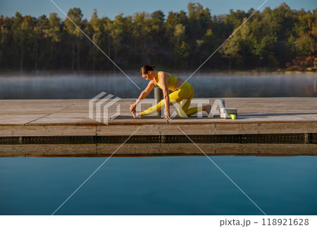 Morning Stretch by the Lake An Invigorating Journey of Serenity and Pure Calmness Morning Stretch by the Lake An Invigorating Journey of Serenity and Pure Calmness 118921628