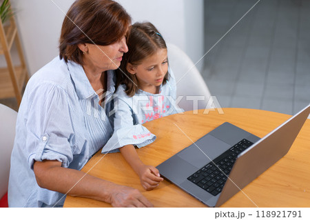 From above of granddaughter and grandmother using From above of granddaughter and grandmother using 118921791