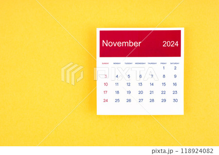 Calendar page November 2024 on yellow background. 118924082
