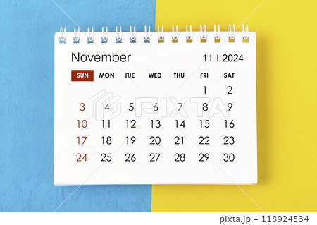 November 2024 Monthly desk calendar for 2024 year on blue and yellow. 118924534