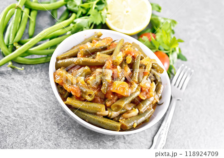 Beans green with vegetables in bowl on stone table Beans green with vegetables in bowl on stone table 118924709