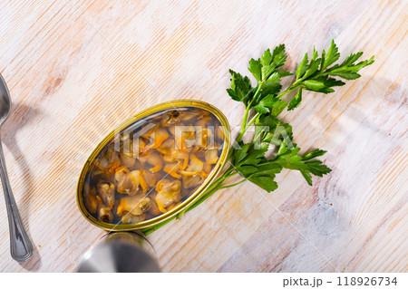 Preserved natural mussels with parsley Preserved natural mussels with parsley 118926734
