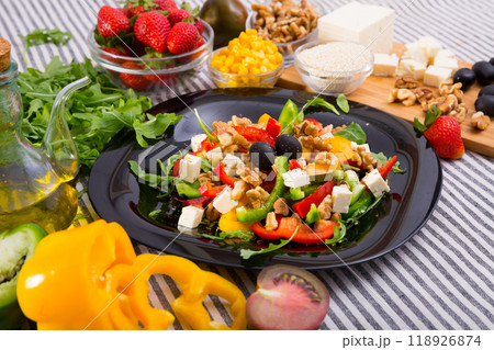 Ingredients for salad from arugula and vegetables Ingredients for salad from arugula and vegetables 118926874