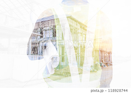 Double exposure image of professional engineer in protective helmet and blueprints paper at building construction site Double exposure image of professional engineer in protective helmet and blueprints paper at building construction site 118928744
