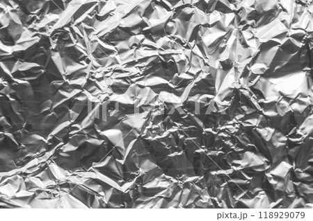 Shiny metal silver gray foil crumpled texture background Shiny metal silver gray foil crumpled texture background 118929079