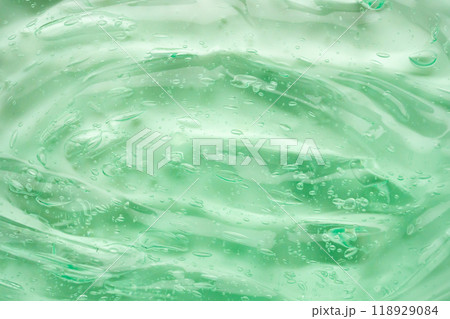 Transparent clear green liquid serum gel cosmetic texture background 118929084
