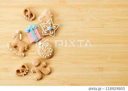 Christmas homemade gingerbread cookies on wooden table. 118929803
