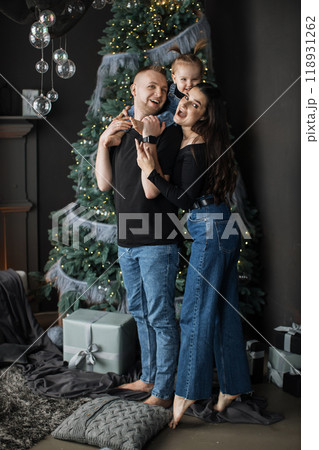 Happy family enjoying Christmas time together at home 118931262