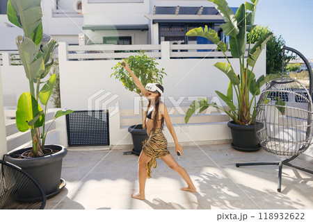 A Dynamic Woman Posing Gracefully in a Beautiful Tropical Outdoor Setting During Summer A Dynamic Woman Posing Gracefully in a Beautiful Tropical Outdoor Setting During Summer 118932622