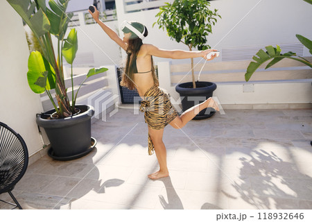 An Invigorating and Joyful Outdoor Dance in a Beautiful Tropical Setting with Vivid Colors An Invigorating and Joyful Outdoor Dance in a Beautiful Tropical Setting with Vivid Colors 118932646