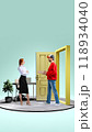 Delivery man and businesswoman exchanging package through large door, illustrating professional side of online shopping and efficient delivery services. 118934040