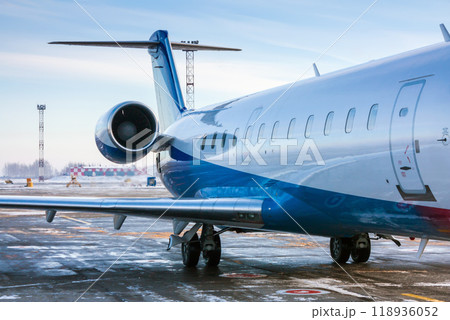 The rear of the passenger aircraft in a cold winter airport 118936052