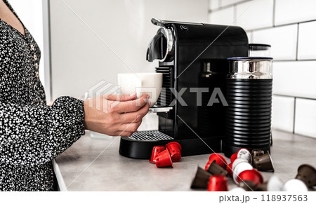 Capsule coffee machine at domestic kitchen Capsule coffee machine at domestic kitchen 118937563